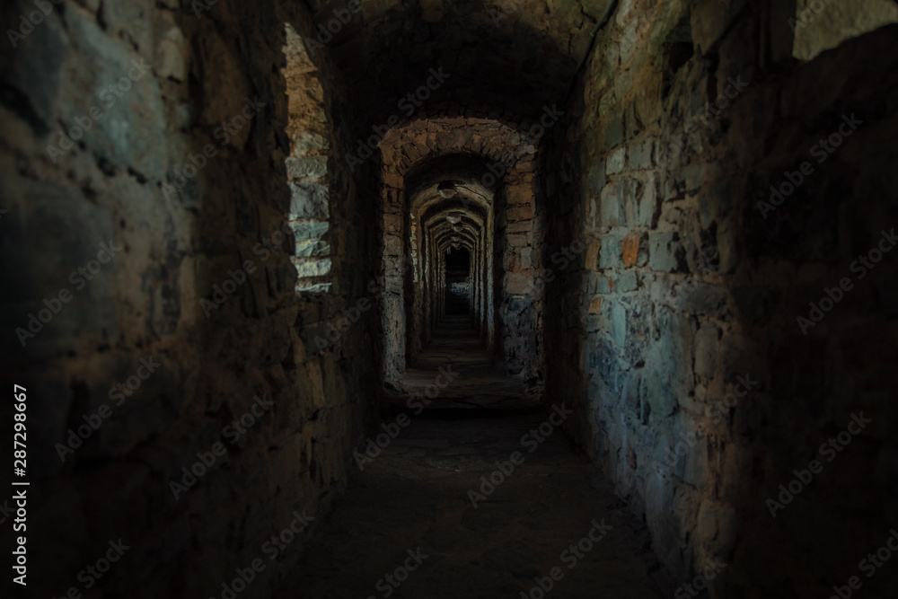 dark scary dark corridor underground path way of ancient fortress 