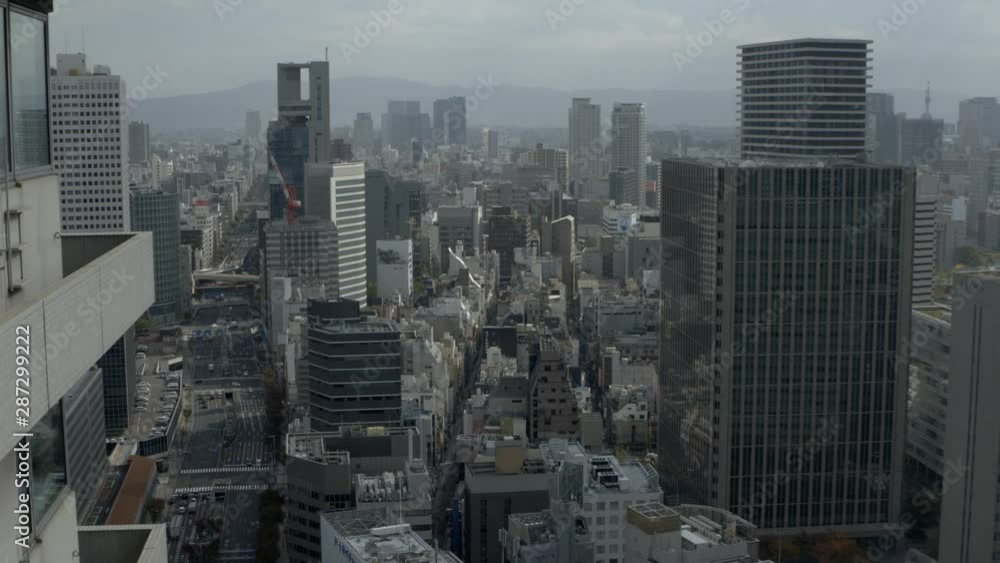Osaka City Japan Downtown Cityscape. Modern Japanese Metropolis and Skyscrapers Under Mist