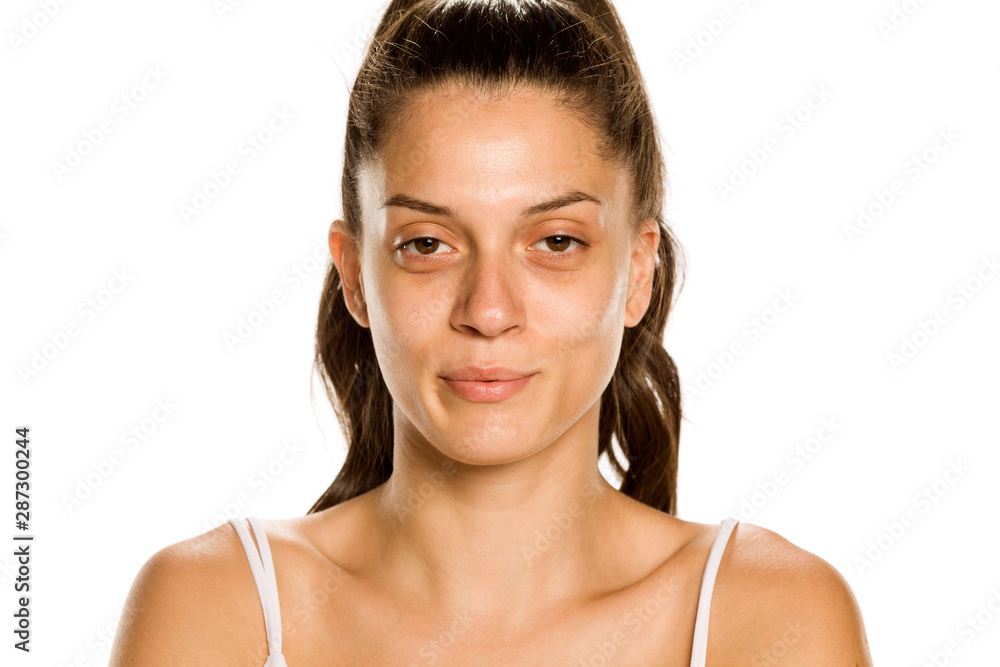 Young woman without makeup on white background Young woman without makeup on white background