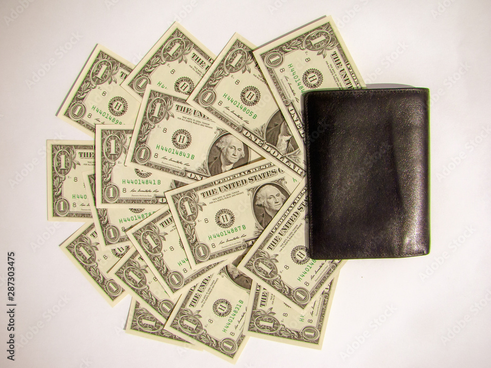 Banknotes of 1 US dollar are fanned out of the wallet. White background. Banknotes of 1 US dollar are fanned out of the wallet. White background.