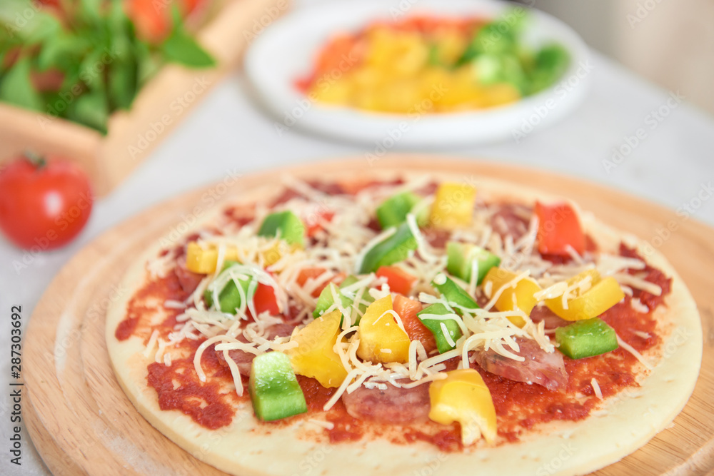 Raw pizza dough with tomato sauce, ingredients Raw pizza dough with tomato sauce, ingredients