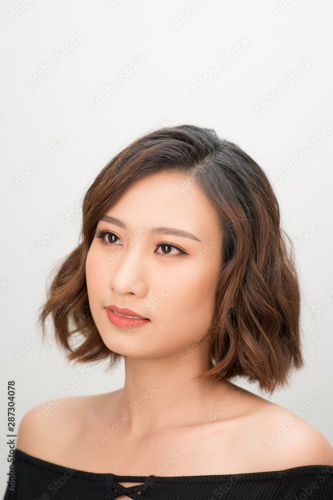 Close up young Asian woman portrait on white background Close up young Asian woman portrait on white background