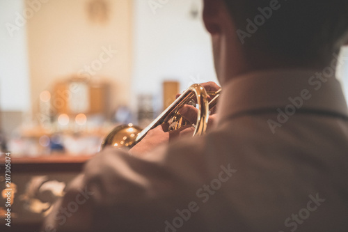 Musician plays from a church organ during a wedding photo