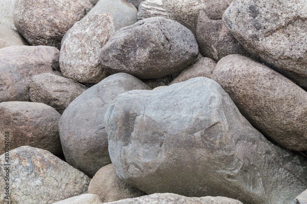 Retaining wall made of stones, boulders. Stone of volcanic rocks, granite, basalt, gabro. Bank protection on the sea beach. Protection of the coast from destruction by waves. Waterworks. Retaining wall made of stones, boulders. Stone of volcanic rocks, granite, basalt, gabro. Bank protection on the sea beach. Protection of the coast from destruction by waves. Waterworks.