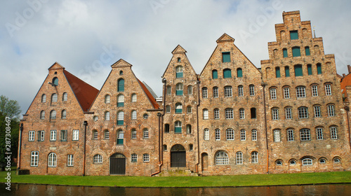Scenic view of Salzspeicher brick warehouses in old town, beautiful architecture, sunny day, Lubeck, Germany
