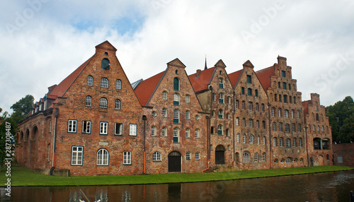 Beautiful view of Salzspeicher brick warehouses in old town, beautiful architecture, sunny day, Lubeck, Germany