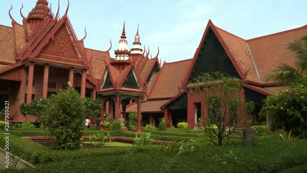 A daylight shot with downward tilting view of the exterior facade and garden landscape of the National Museum of Cambodia located in Phnom Penh. A daylight shot with downward tilting view of the exterior facade and garden landscape of the National Museum of Cambodia located in Phnom Penh.