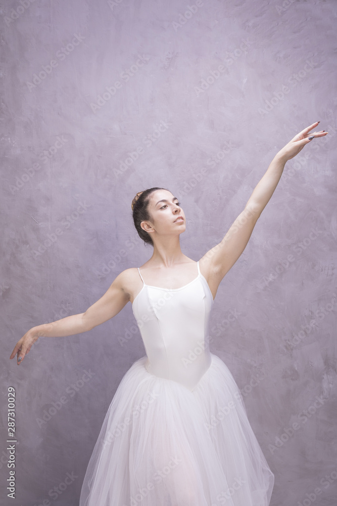 Naklejka premium Front view ballerina with stucco background