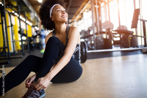 Close up image of attractive fit woman in gym