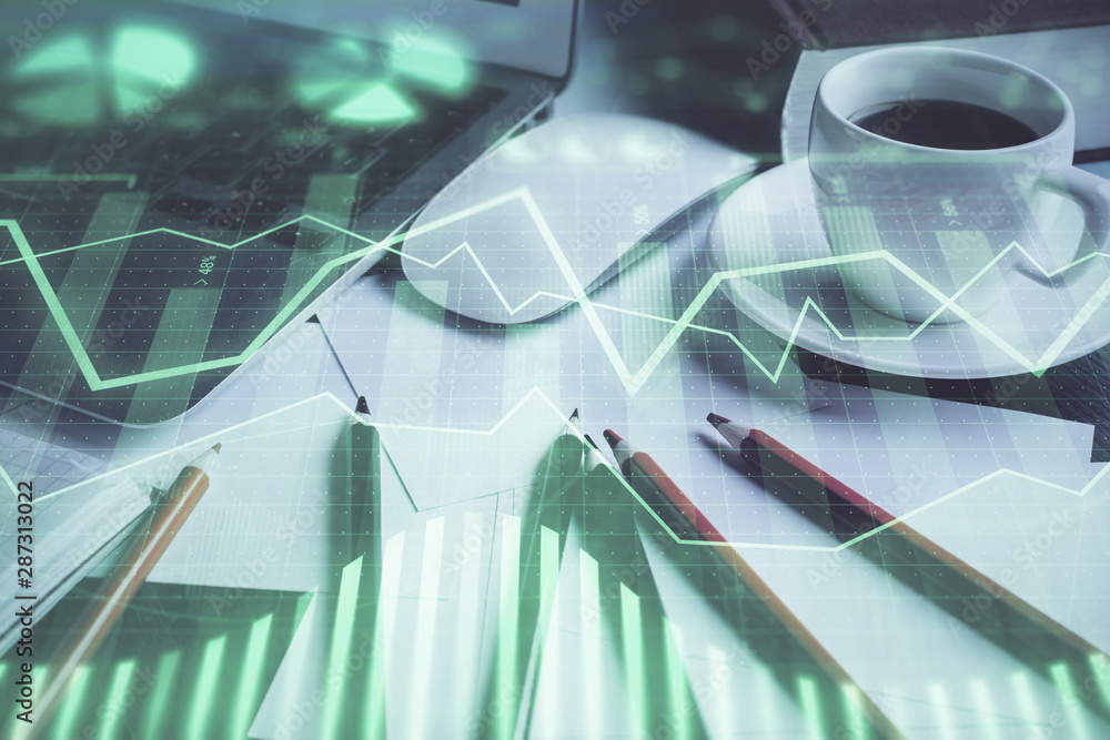 Stock market graph on background with desk and personal computer. Multi exposure. Concept of financial analysis. Stock market graph on background with desk and personal computer. Multi exposure. Concept of financial analysis.