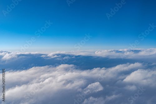 View of dark blue sky horizon in sun rise time, up in the air. viewed from an airplane window © Shawn.ccf