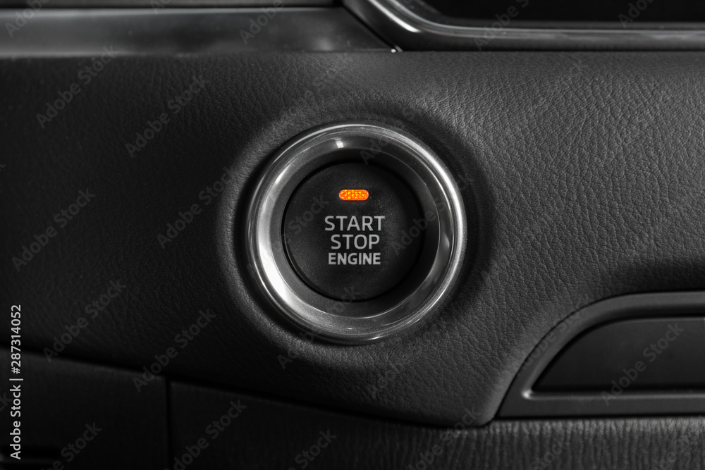 Start stop engine button of modern luxury car.