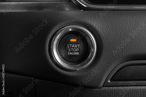 Start stop engine button of modern luxury car.