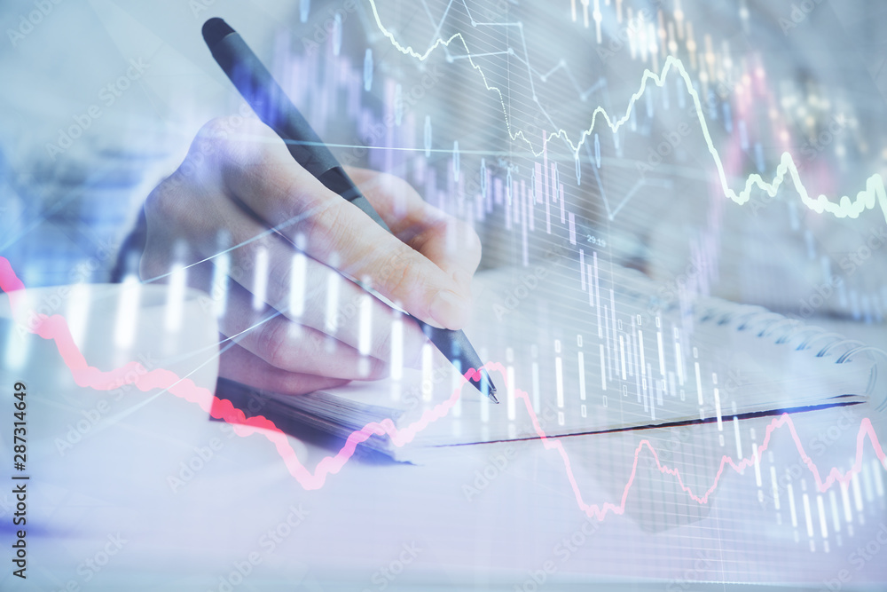 Forex chart displayed on woman's hand taking notes background. Concept of research. Double exposure Forex chart displayed on woman's hand taking notes background. Concept of research. Double exposure