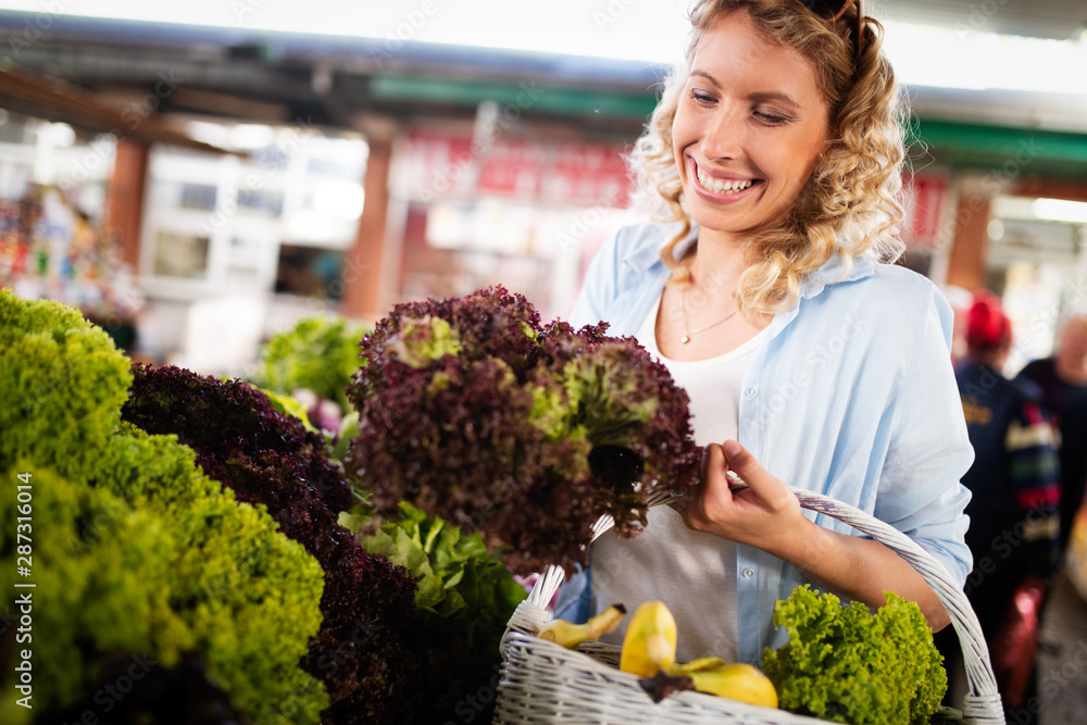 Picture of woman at marketplace buying vegetables Picture of woman at marketplace buying vegetables