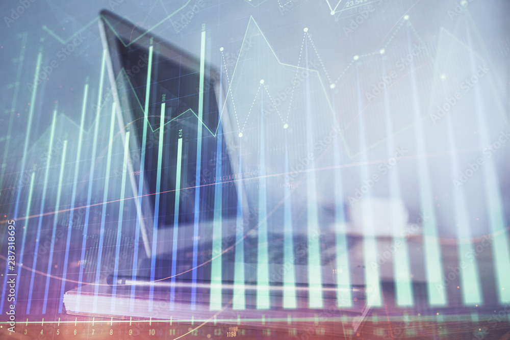 Stock market graph and table with computer background. Double exposure. Concept of financial analysis. Stock market graph and table with computer background. Double exposure. Concept of financial analysis.