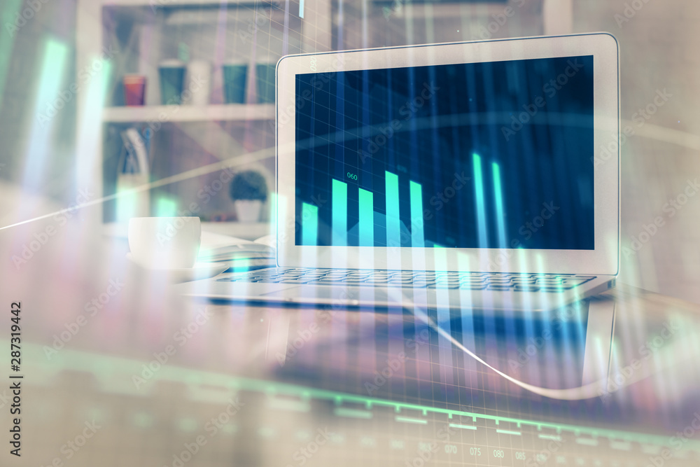 Stock market chart hologram drawn on personal computer background. Double exposure. Concept of investment. Stock market chart hologram drawn on personal computer background. Double exposure. Concept of investment.