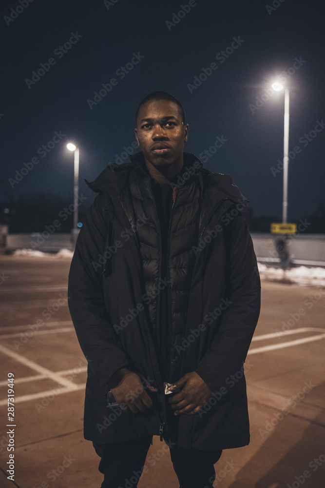 young african man outdoors posing looking camera young african man outdoors posing looking camera