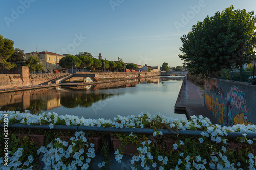 View from the bridge to the river in the city of Rimini (Italy) photo