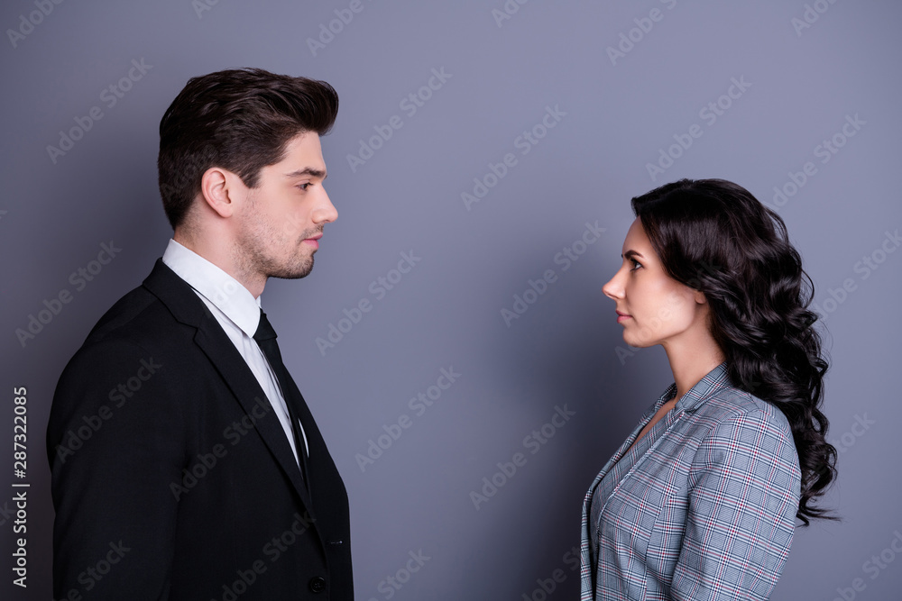 Profile side photo of minded people with wavy curly hairstyle brunet hairs standing face-to-face having disagreement wearing stylish blazer jacket tie isolated over grey background Profile side photo of minded people with wavy curly hairstyle brunet hairs standing face-to-face having disagreement wearing stylish blazer jacket tie isolated over grey background