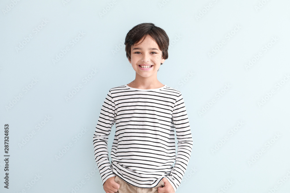 Happy little boy on light background Happy little boy on light background