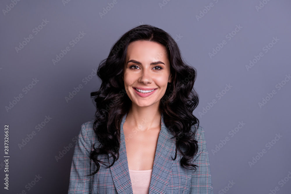 Close up photo of charming freelancer looking with toothy smile wearing suit isolated over grey background Close up photo of charming freelancer looking with toothy smile wearing suit isolated over grey background
