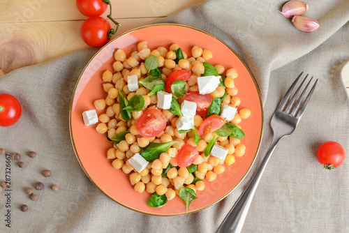 Wallpaper Mural Plate with tasty chickpea salad on table Torontodigital.ca