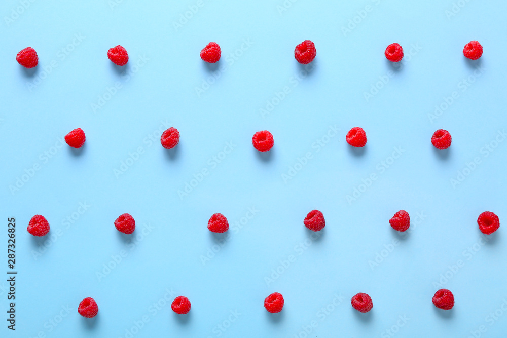 Many sweet ripe raspberry on color background