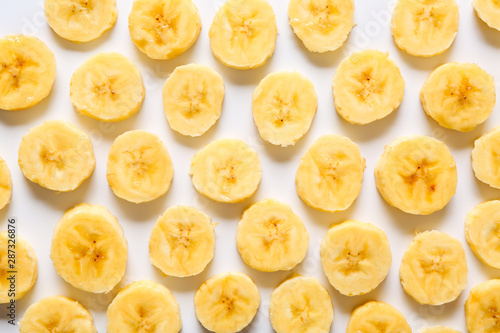 Many banana slices on white background © Pixel-Shot