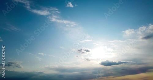 Beautiful sunset timelapse with sky and running rain clouds on blue sky. 4K time lapse clip