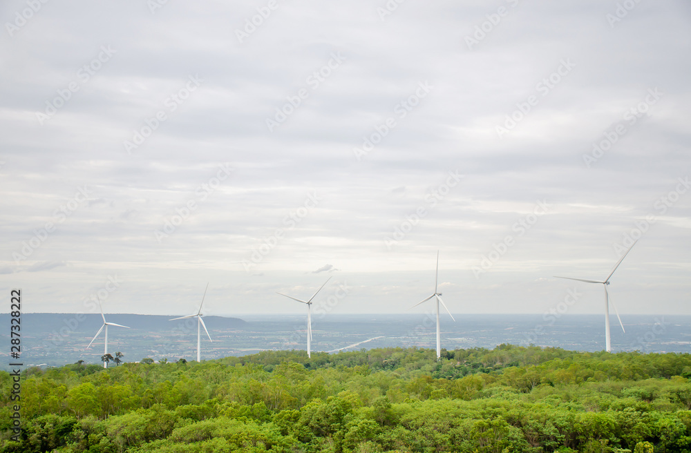 Aerial view of Wind turbine with hybrid tower on agricultural fields. Renewable energy production for green ecological world at Yai-Tiang hill,Thailand 