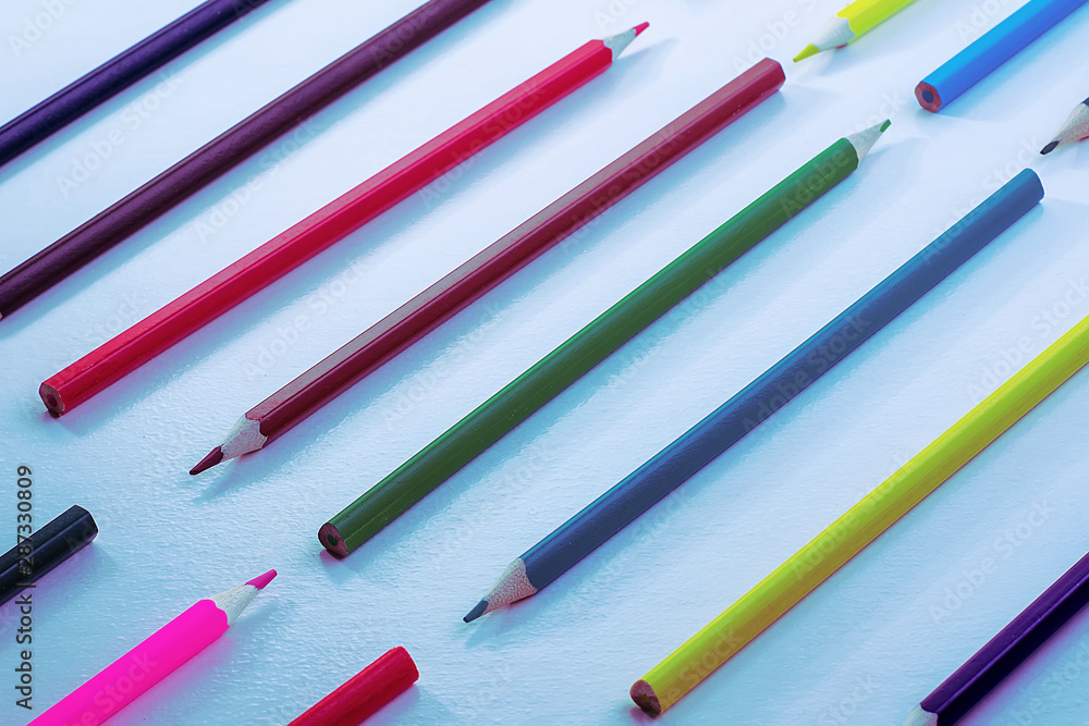 A pattern of wooden color pencils in neon light. Minimal beauty concept. Copy space concept back to school, learning process, study at school, drawing A pattern of wooden color pencils in neon light. Minimal beauty concept. Copy space concept back to school, learning process, study at school, drawing