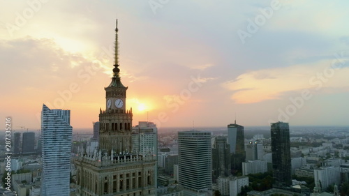 Aerial Panoramic View of Warsaw City Centre Downtown at Sunset, Poland, Europe. Urban Skyline with Skyscrappers, Car Roads and Main Landmark - Palace of Culture and Science.