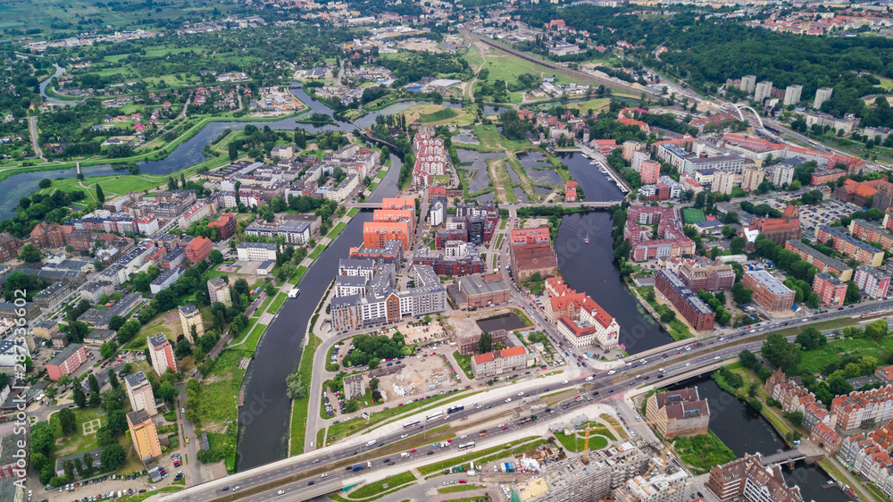 Gdansk, Poland. Aerial skyline panorama with Motlawa river, modern drawbridge, concert hall and all famous monuments in the background