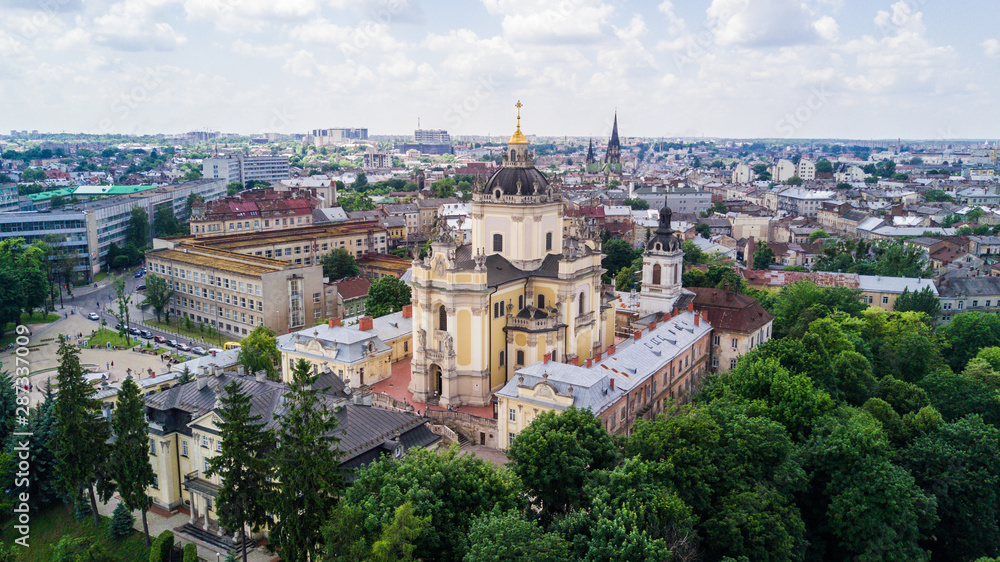 Aerial view of Lviv old european city with red roofs. city hall tower. copy space