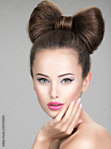 Beautiful woman with stylish bow hairstyle.