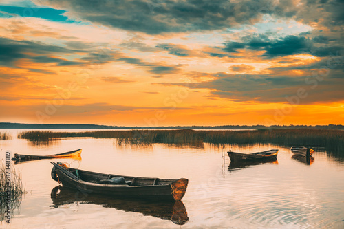 Braslaw Or Braslau, Vitebsk Voblast, Belarus. Wooden Rowing Fishing Boats In Beautiful Summer Sunset On The Dryvyaty Lake. This Is The Largest Lake Of Braslav Lakes. Typical Nature Of Belarus photo