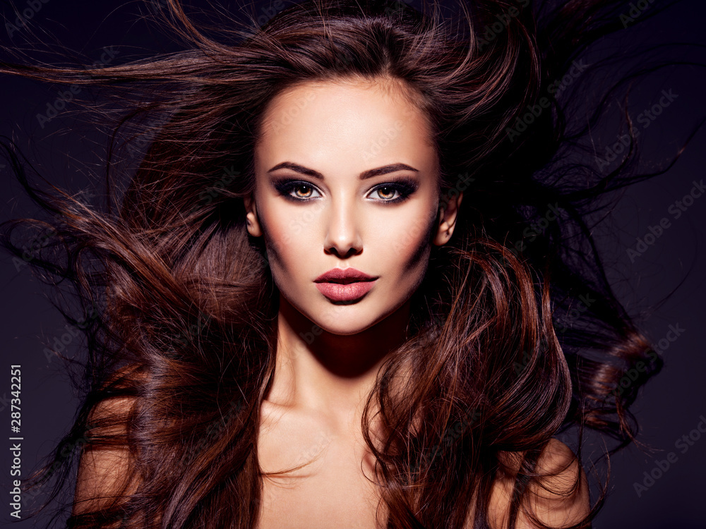 Face of the beautiful sexy woman with long brown hair Face of the beautiful sexy woman with long brown hair