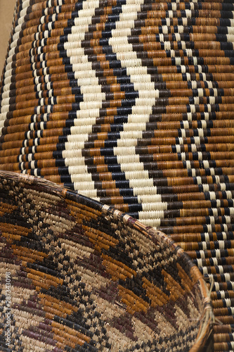 African wickerwork with zigzag patterns. Locally woven baskets from Chobe region; Zambezi (Caprivi Strip), Namibia.