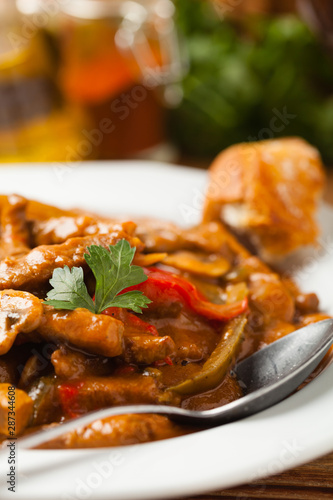 Boeuf, Stroganow, Strogonow. Classic, Russian beef stew. Served on a white plate. Front view. Natural background.