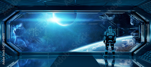 Fototapeta Naklejka Na Ścianę i Meble -  Astronaut in futuristic spaceship watching space through a large window 3d rendering elements of this image furnished by NASA