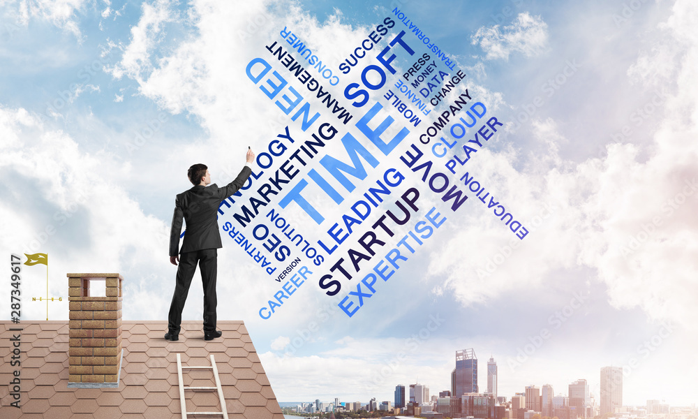 Young businessman standing on house roof and writing leadership skill concept. Mixed media Young businessman standing on house roof and writing leadership skill concept. Mixed media
