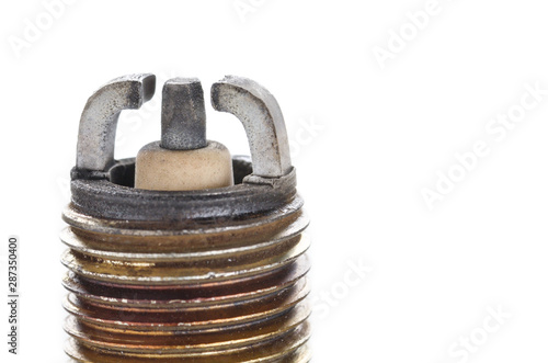 Closeup photo of old used spark plug for internal combustion engine. Space for text