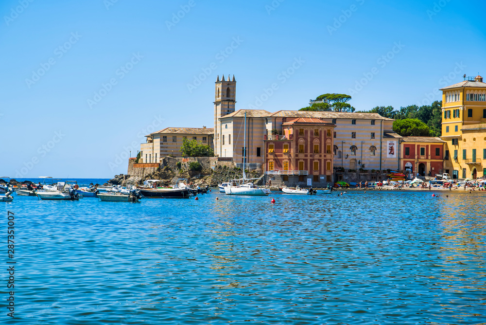 Sestri Levante, Liguria, Italy - August 16, 2019: resort town on the Riviera Levante / Sandy beach on the sea coast with beautiful views / Beach in Silence Bay /