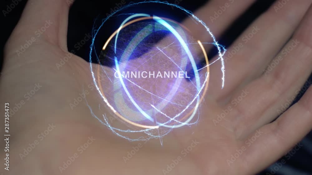 Omnichannel text in a round conceptual hologram on a female hand. Close-up of a hand on a black background with future holographic technology Omnichannel text in a round conceptual hologram on a female hand. Close-up of a hand on a black background with future holographic technology