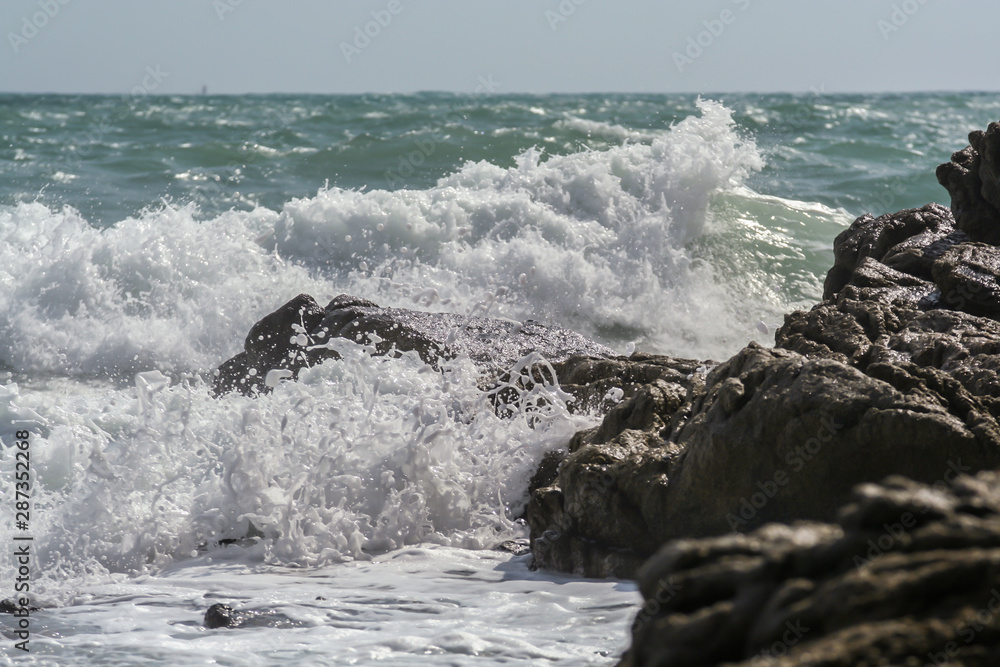 Fototapeta premium 2011.05.08, Phuket, Thailand. Ocean waves crashing on the rocks. Nature of Asia.