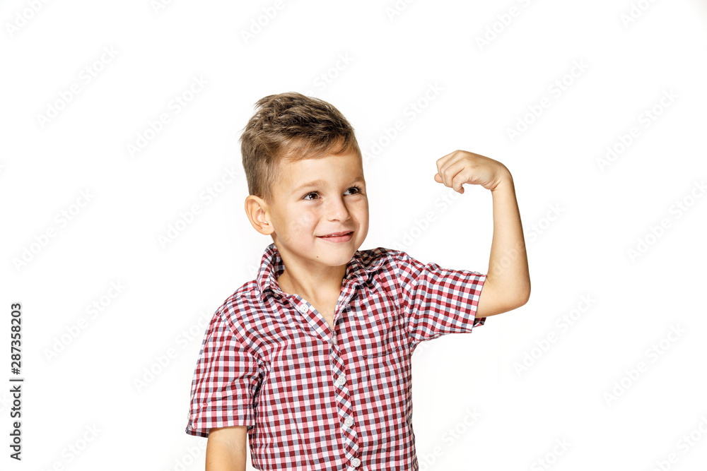 handsome boy shows his strength on white background handsome boy shows his strength on white background