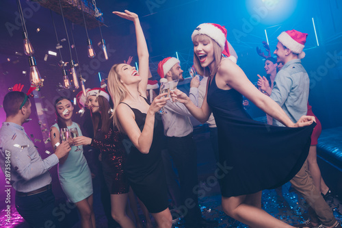 Portrait of nice attractive smart stylish cheerful cheery positive excited glad dreamy ladies and guys having fun rest relax feast festal celebratory at modern luxury fogged lights nightclub