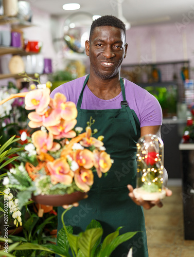 Owner of floral shop offering flower compositions © JackF