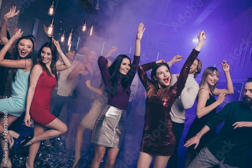Portrait of attractive pretty sweet high-school person raising hands arms people occasion excited laugh laughter formalwear formal wear dress indoors dance floor